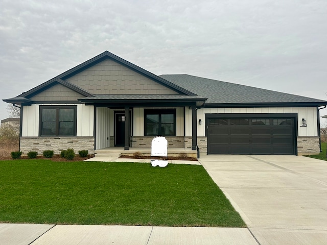 view of front of house with a garage and a front lawn