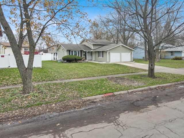 ranch-style home with a front lawn and a garage