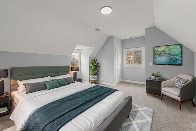 carpeted bedroom featuring a closet and lofted ceiling