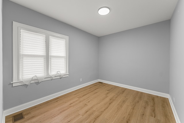 unfurnished room featuring light wood-type flooring