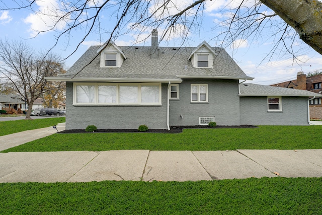 view of side of property featuring a yard