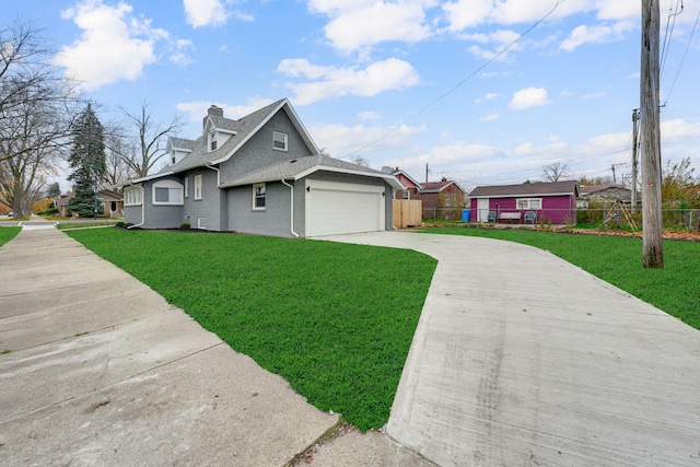 view of side of home featuring a yard and a garage