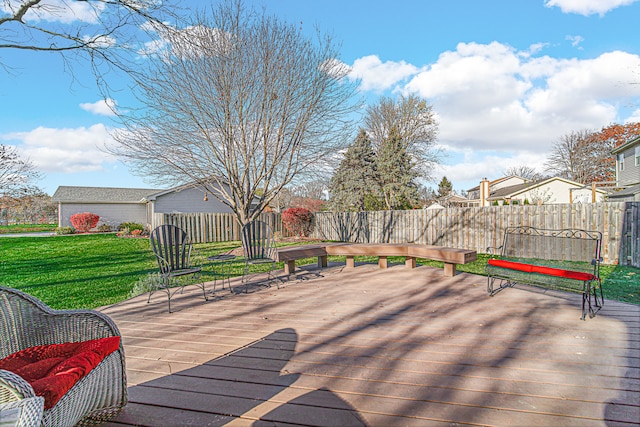 wooden deck with a lawn