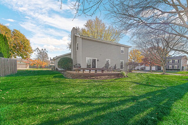 rear view of house with a yard and a patio area