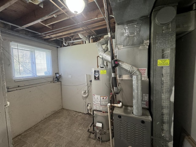 utility room featuring water heater