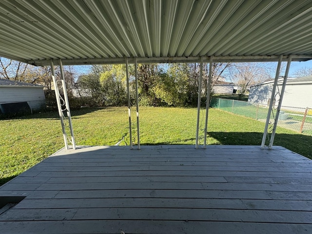 wooden terrace with a yard