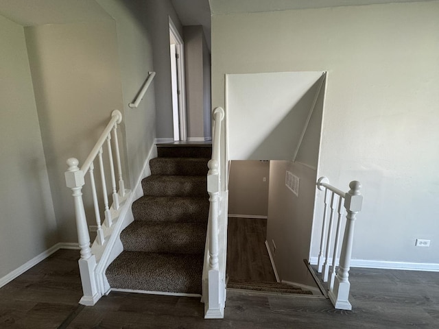 stairway with wood-type flooring