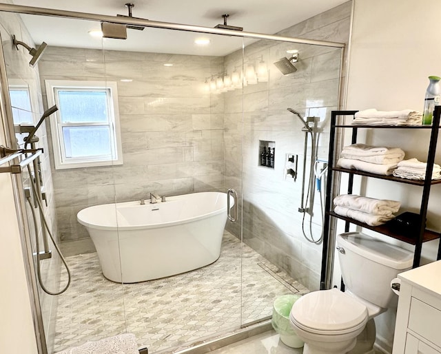 full bathroom featuring vanity, plus walk in shower, tile walls, and toilet