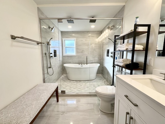 full bathroom featuring vanity, toilet, and shower with separate bathtub