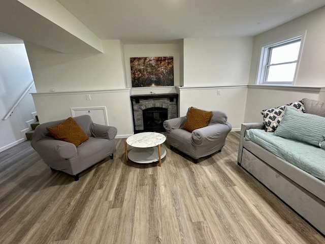 living room featuring hardwood / wood-style flooring and a fireplace