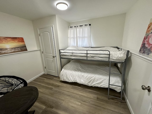 bedroom featuring dark wood-type flooring