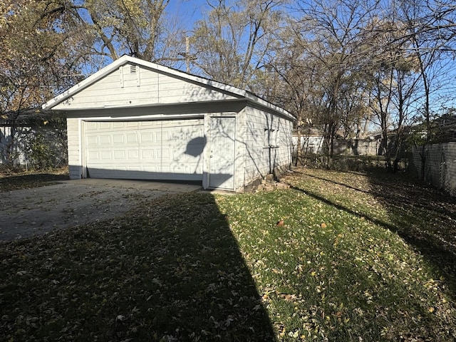 view of property exterior featuring an outbuilding and a garage