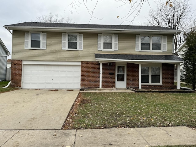 view of front of property with a garage and a front yard