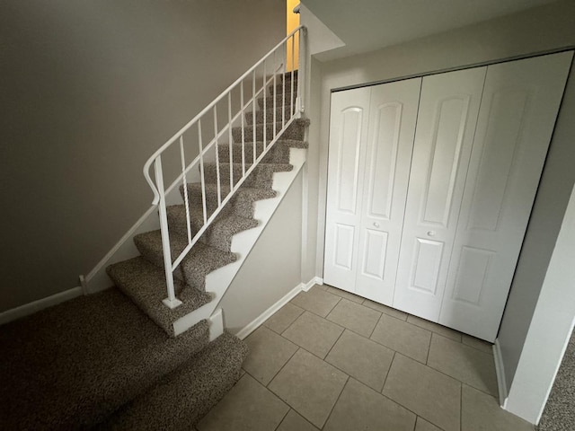 staircase with tile patterned flooring