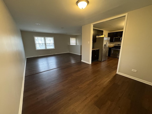 unfurnished living room featuring dark wood-type flooring