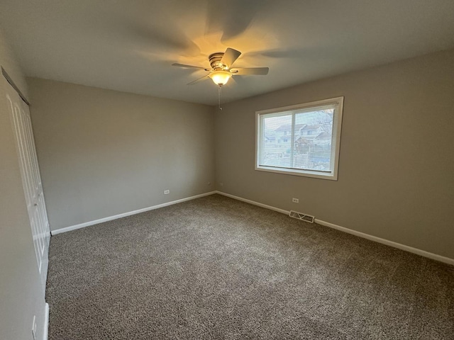 carpeted empty room with ceiling fan