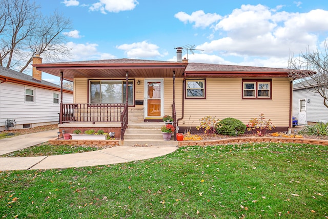 view of front of house featuring covered porch and a front lawn