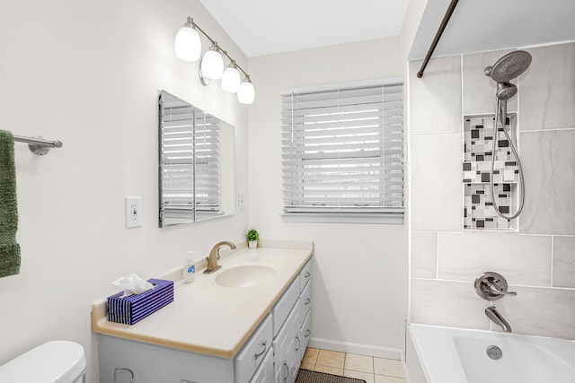 full bathroom with toilet, vanity, tile patterned floors, and tiled shower / bath combo