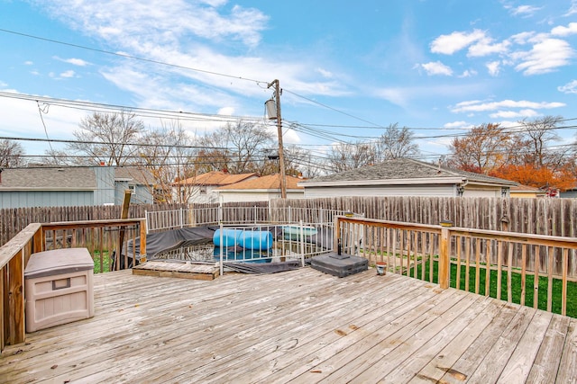 wooden terrace featuring a pool