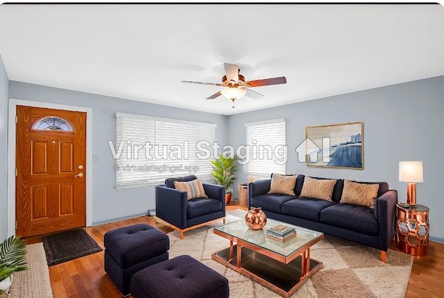 living room with ceiling fan and light hardwood / wood-style floors