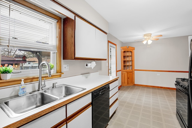 kitchen featuring ceiling fan, sink, white cabinets, and black appliances