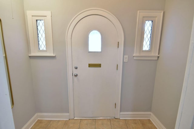 tiled entryway featuring a wealth of natural light