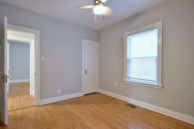 empty room featuring light hardwood / wood-style flooring and ceiling fan