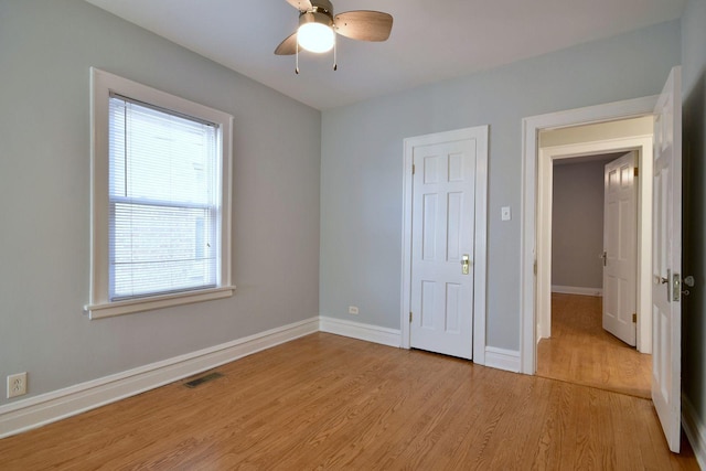 unfurnished bedroom with light hardwood / wood-style flooring and ceiling fan