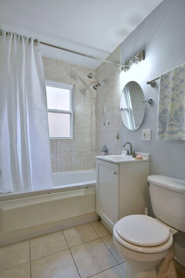 full bathroom featuring tile patterned flooring, vanity, toilet, and shower / bathtub combination with curtain