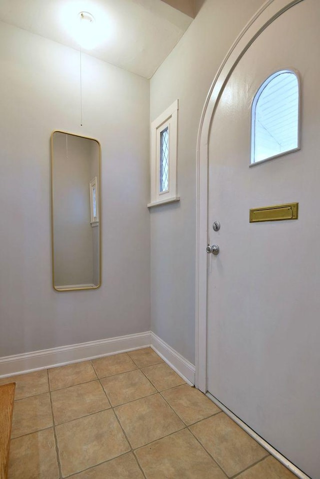 entrance foyer with light tile patterned floors