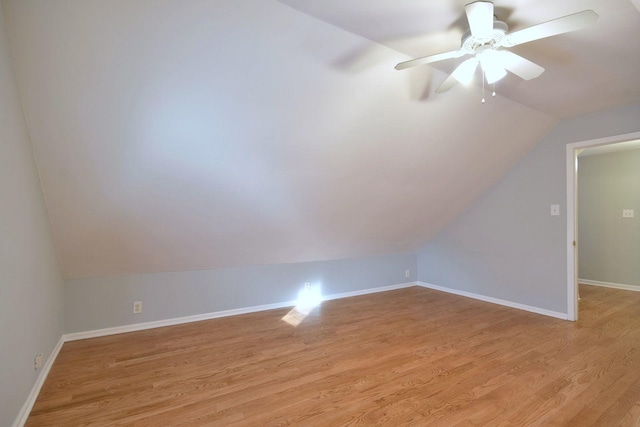 bonus room featuring ceiling fan, light hardwood / wood-style floors, and vaulted ceiling