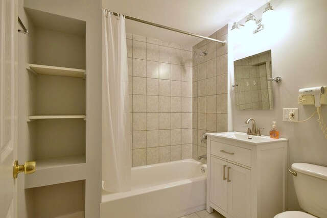 full bathroom featuring vanity, toilet, and shower / tub combo with curtain