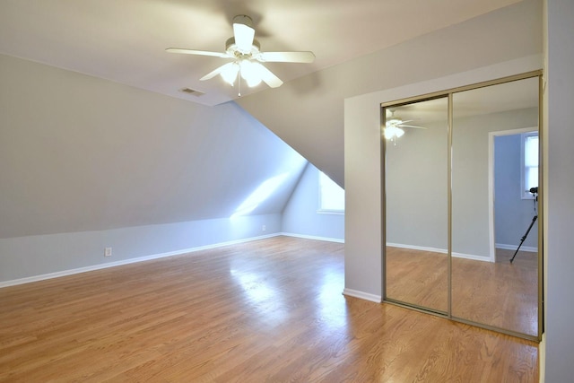 additional living space with ceiling fan, lofted ceiling, and light hardwood / wood-style flooring