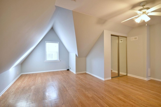 additional living space featuring ceiling fan, light hardwood / wood-style floors, and lofted ceiling