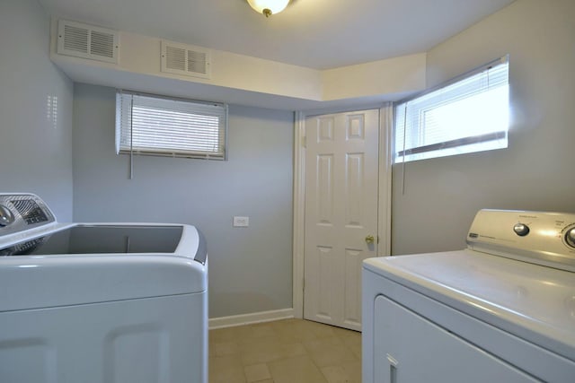 laundry room with washer and dryer