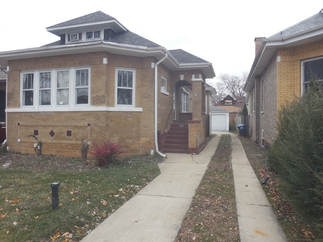 view of property exterior featuring an outbuilding and a garage