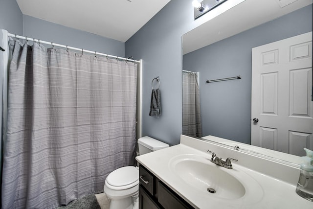 bathroom featuring vanity, a shower with curtain, and toilet