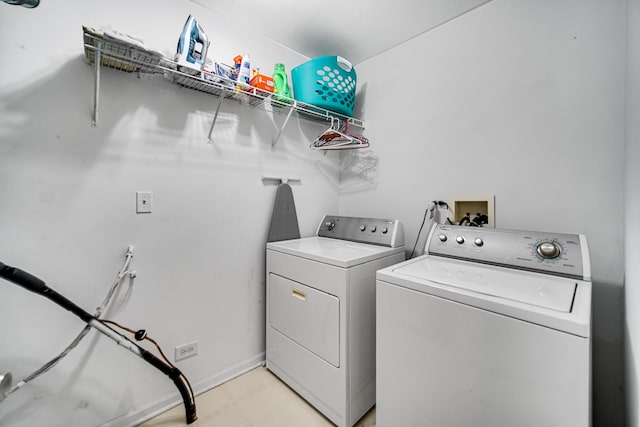 clothes washing area featuring laundry area and separate washer and dryer