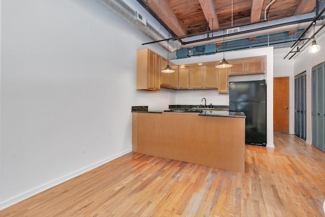 kitchen featuring black fridge, decorative light fixtures, light hardwood / wood-style floors, kitchen peninsula, and wood ceiling