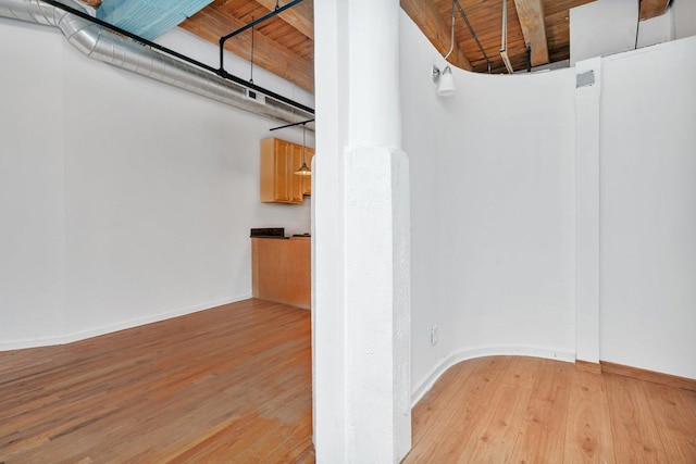 interior space featuring wooden ceiling and light hardwood / wood-style floors