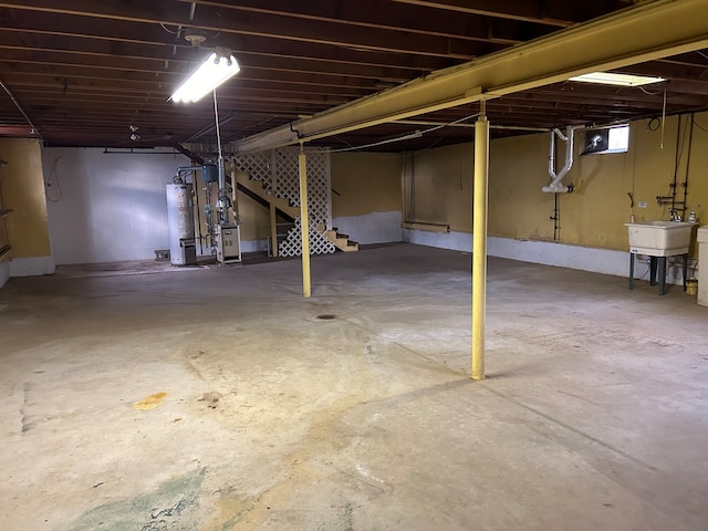 basement with sink and gas water heater