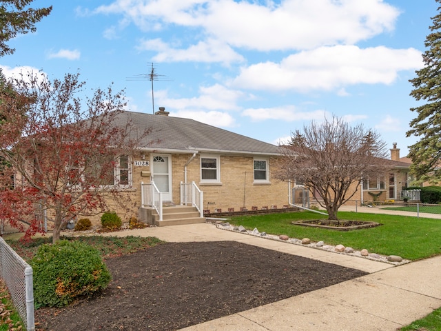 ranch-style house with a front lawn