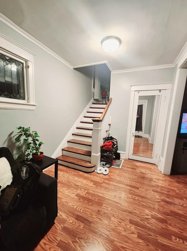 interior space with ornamental molding and light wood-type flooring