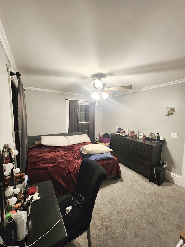 carpeted bedroom featuring ceiling fan and ornamental molding