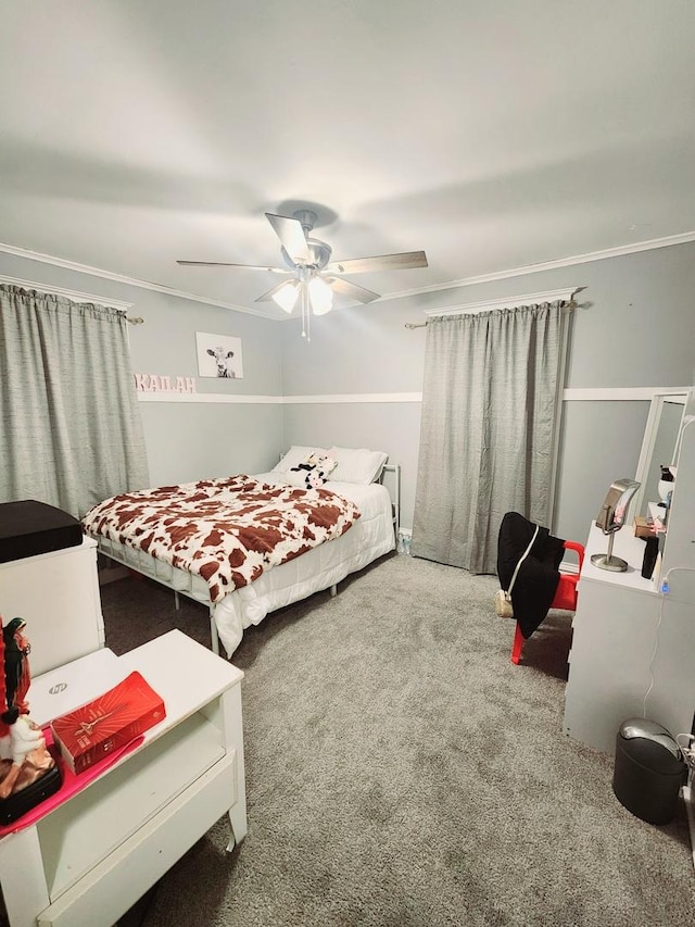 bedroom featuring carpet, ceiling fan, and crown molding