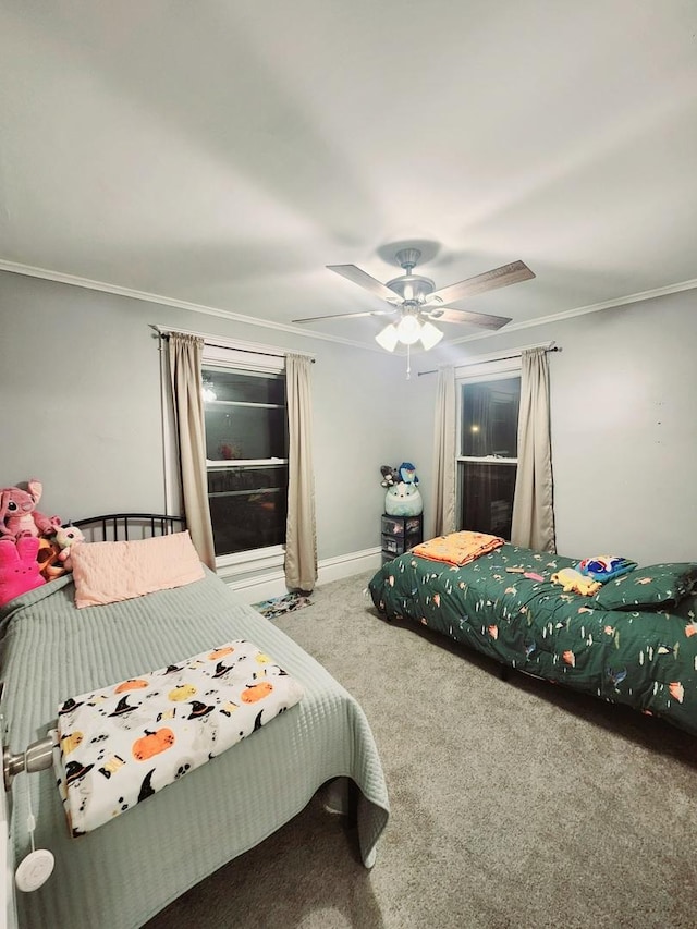 carpeted bedroom featuring ceiling fan and ornamental molding