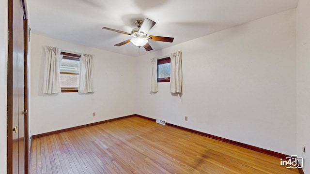 unfurnished room with light hardwood / wood-style flooring and ceiling fan