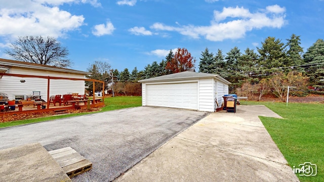 garage featuring a lawn