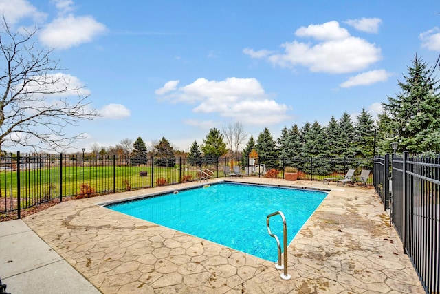 view of pool with a fenced in pool, a patio, and fence