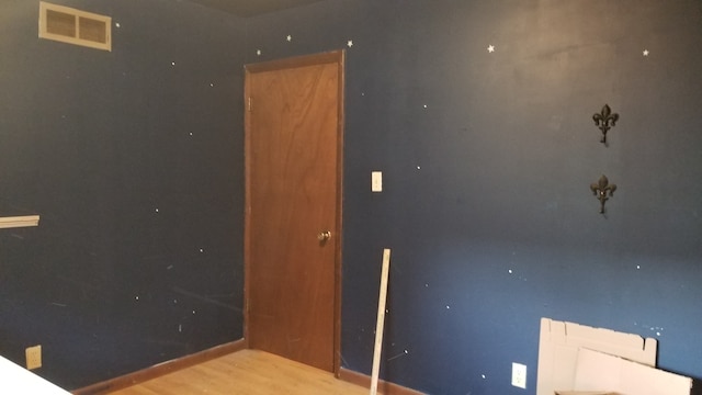 spare room featuring light hardwood / wood-style floors